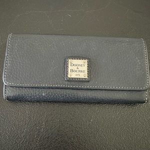 DOONEY & BOURKE wallet used  Does have some wear on the outside and inside.